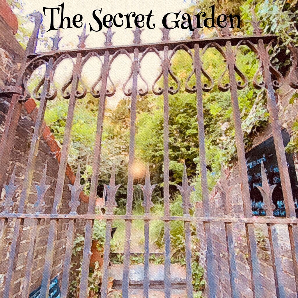 photo looking through the gate of the Secret Garden from Mill Rd