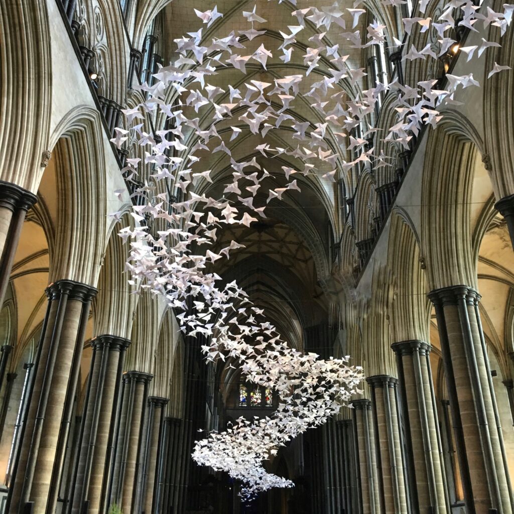 Paper doves disappearing into infinity in the Nave of Salisbury Cathedral