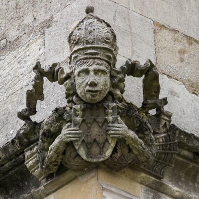 stone carving of king on Oxford College
