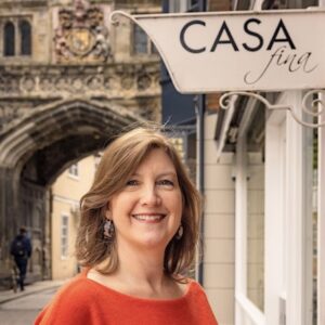 Susi outside Casa Fina in Salisbury High St cathedral gate in the background