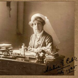 Adeline Cable in uniform at her desk in 1925