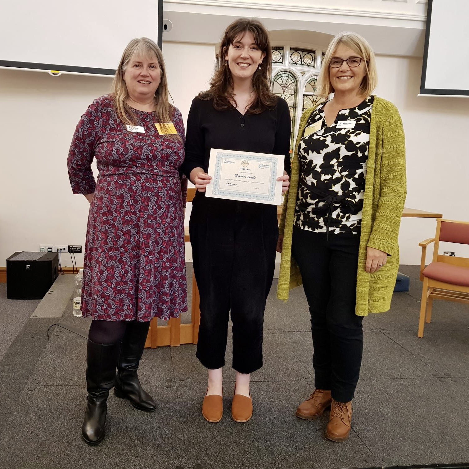 Bronwen Steele one of the winners being presented with her certificate by Club President Eleanor and HSS Project Manager Jenny